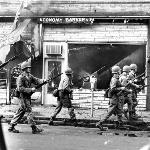 With 12th Street as the riots epicenter, the riot quickly spread in every direction. Here Guardsmen begin the sweep of neighboring Linwood Avenue. 