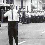 Justice department lawyer John Doar sensed a riot was at hand and jumped in just in time to persuade the anguished crowd, in the name of Medgar Evers, to turn back which they did. 